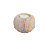 Marble-patterned candle holder with a candle 