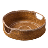Woven seagrass basket with circular patterns